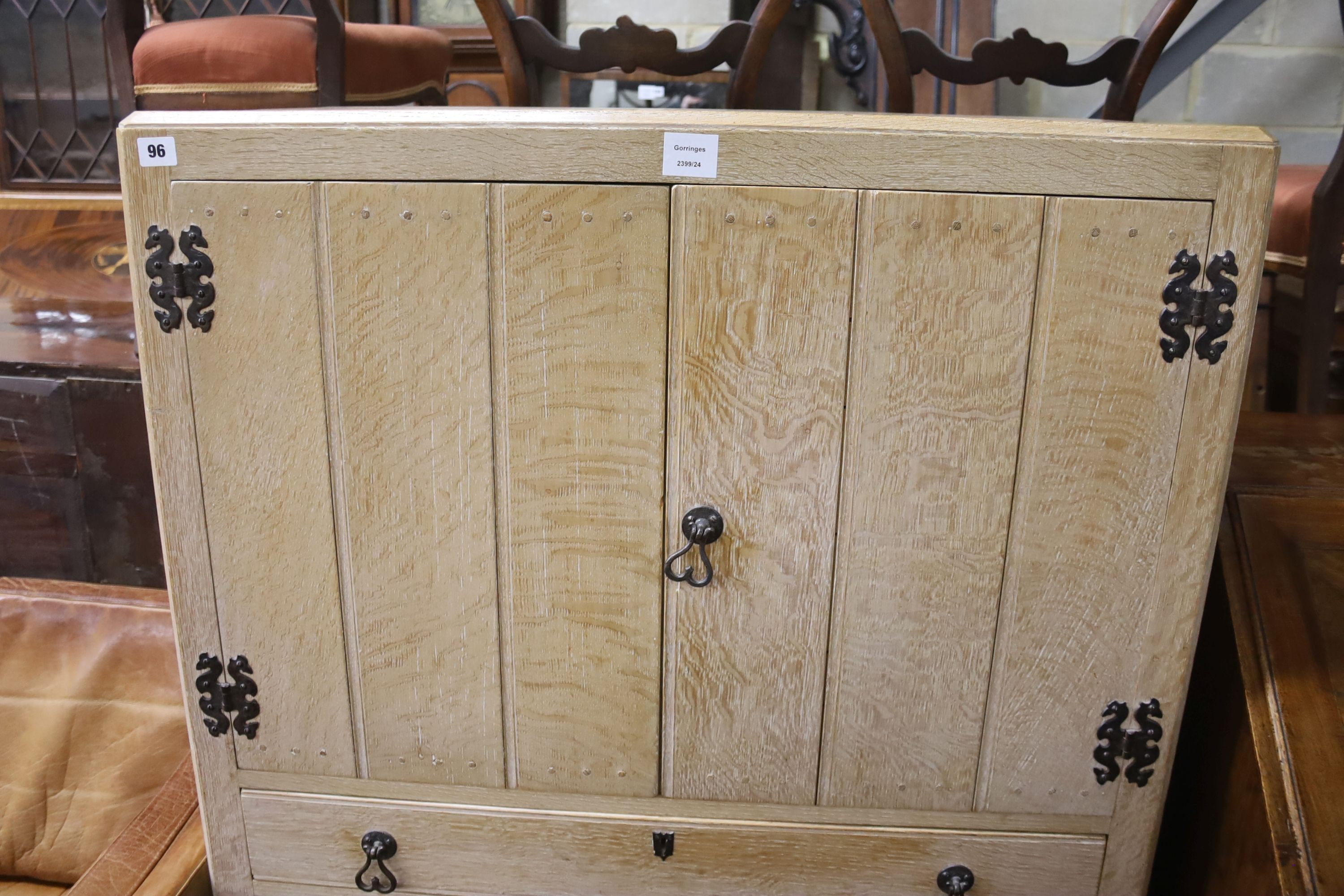 A 1930's bleached oak four drawer cabinet, width 90cm, depth 46cm, height 137cm